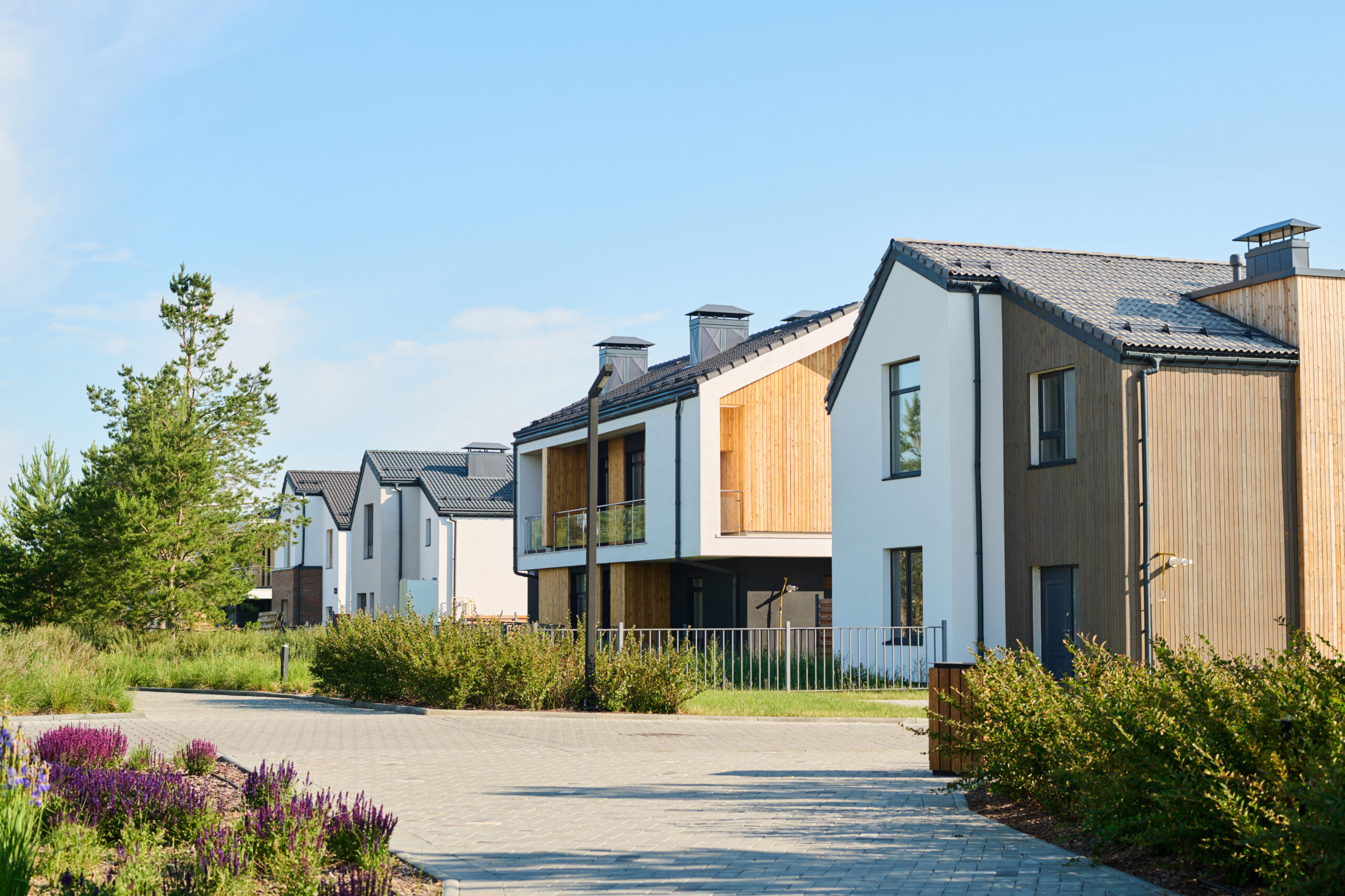 Perspective view of modern two storey village houses with front yards